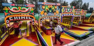 The Xochimilco boats known as trajineras are now operating again with restrictions.