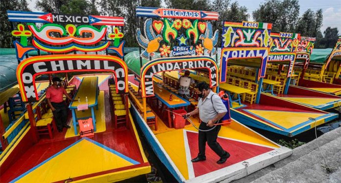 The Xochimilco boats known as trajineras are now operating again with restrictions.