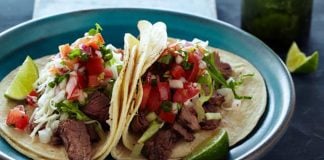 Tacos of carne asada made with an orange marinade.