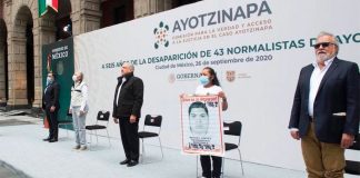 The president and other officials address parents of the missing students on Saturday