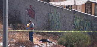 An investigator at the crime scene in Tijuana.