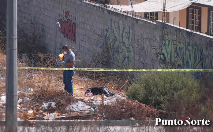 An investigator at the crime scene in Tijuana.