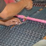 A rebozo is made on a backstrap loom at the Feria de Rebozo in Tenancingo, México state.