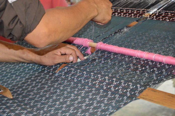 A rebozo is made on a backstrap loom at the Feria de Rebozo in Tenancingo, México state.