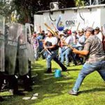 Farmers clash on Tuesday with the National Guard.