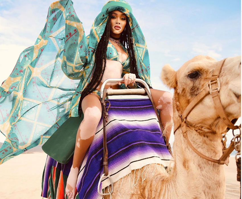Model Winnie Harlow rides a camel in Los Cabos.