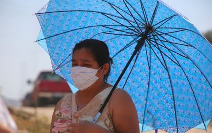 A woman braves the heat in Mexicali