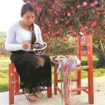 An artisan at work on a coronavirus face mask.