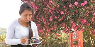 An artisan at work on a coronavirus face mask.