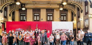 The president with families of the victims on Monday at the National Palace.