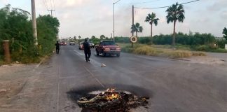 Tires burn on a road in Reynosa.