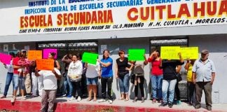 Students protest against teacher who was accused of bullying.