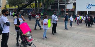 Parents block a street in Mexico City on Thursday.