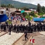 A show of force by police at a rail blockade in Michoacán.