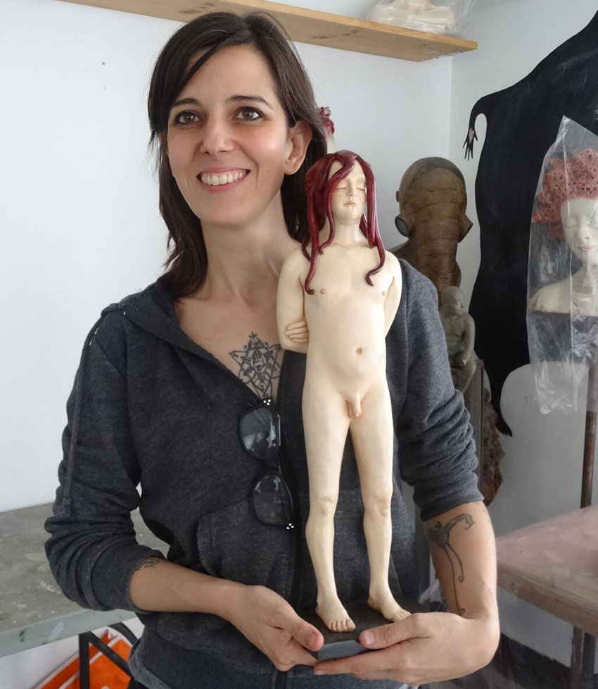 Dalla with one of her sculptures