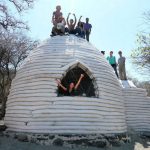 The construction technique: coils of earth bags in a bee-hive shape.