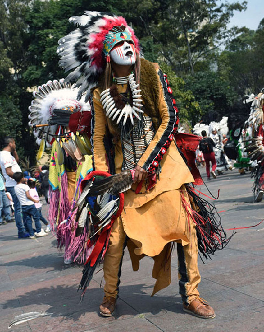A Kikapoo dancer, whose dress resembles that of Plains Indians in the US.