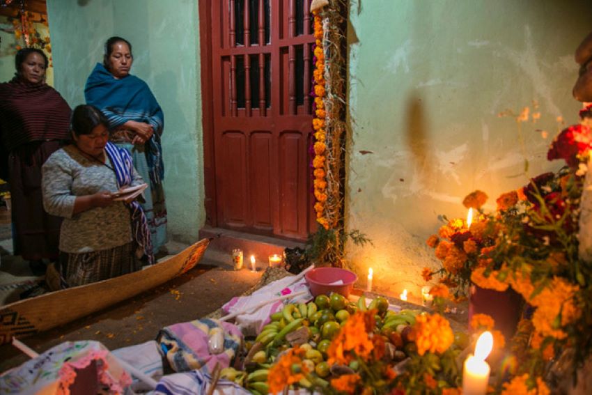 Praying at the altar in Santa Fe de Laguna, Michoacán