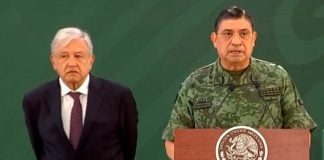 López Obrador and army chief Luis Crescencio Sandoval, whose institution has been embarrassed by the arrest of its former chief.