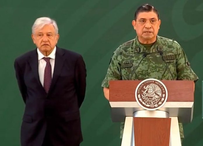 López Obrador and army chief Luis Crescencio Sandoval, whose institution has been embarrassed by the arrest of its former chief.