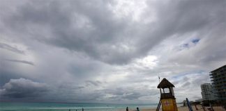 Ominous skies and a near-empty beach in Cancún prior to the arrival of Hurricane Delta.