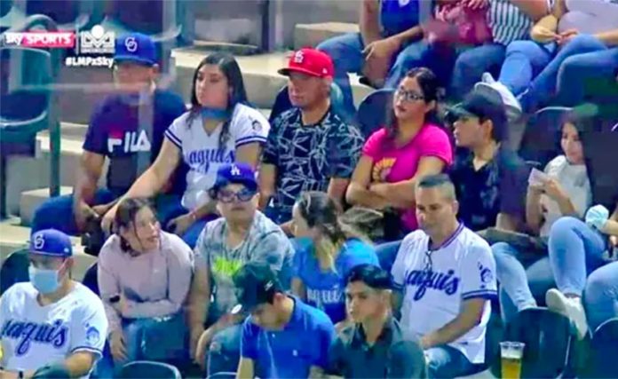 Few masks are evident among these fans at a ball game in Sinaloa.