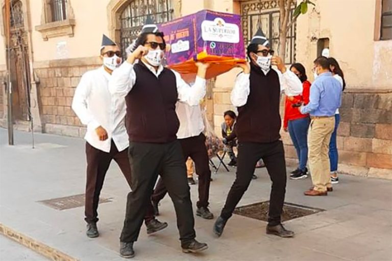 Dancing pallbearers sell Day of the Dead bread in San Luis Potosí Dancing pallbearers sell Day of the Dead bread in San Luis Potosí