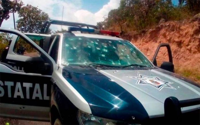 A bullet-riddled police vehicle after the attack in Durango.