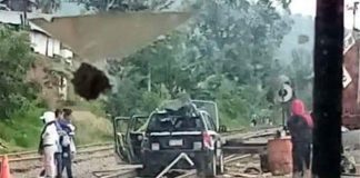 A police vehicle blocks the tracks in Uruapan.