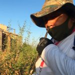 An Obregón searcher sniffs a metal rod for evidence of a body.