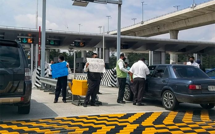 Tourism sector workers collect tolls at Tlalpan