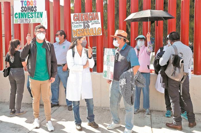 Scientific researchers and students protest in Mexico City Thursday.