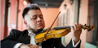 Violinist Genghis Díaz keeps himself employed.