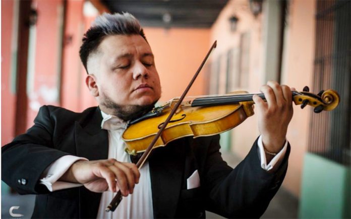 Violinist Genghis Díaz keeps himself employed.