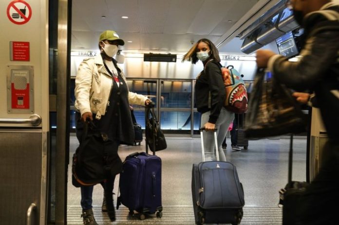Many Americans this year are risking packed airports and potentially unsafe Thanksgiving get-togethers.