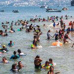 A busy Acapulco beach on the weekend.