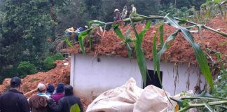 Mud covers a house after a slide in Chiapas.