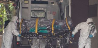 Another Covid patient is wheeled into a Mexico City hospital.