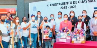 Families of missing persons with their new shovels.