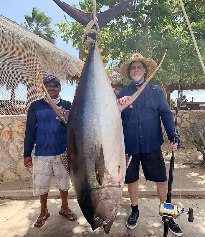 Capt. Castillo and angler Mike Witoshynsky with giant tuna.