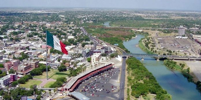 Nuevo Laredo on the left and Laredo on the right, divided by the Rio Grande river.