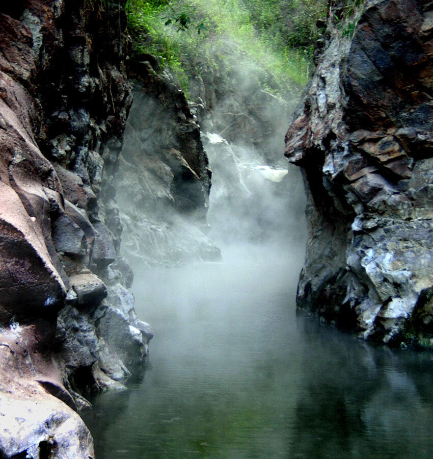 Hot vapors rising at the source of Río Caliente.