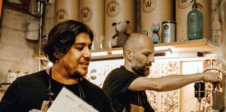 Brew masters Francisco “Paco” Aureliano, left, and Michael Boudey try out a new recipe.