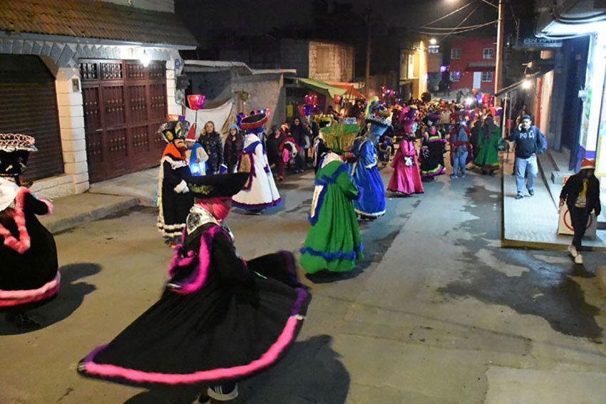 Chinelos are costumed dancers who are part of posada processions.