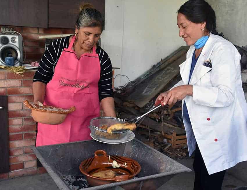 Fernández cooks her dish in a clay pot over charcoal, and swears by the difference in flavor.