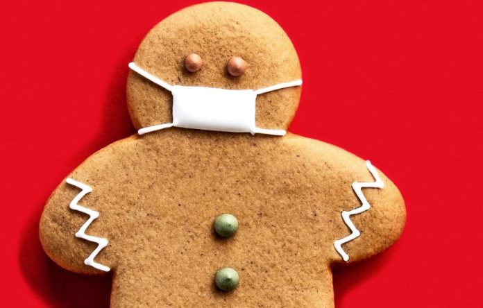 Holiday gingerbread person updated for gift giving in the current era.