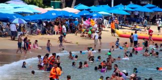A busy beach in Acapulco last March.