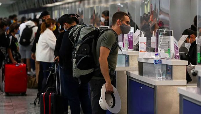 Passengers check in at Guadalajara airport