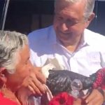 Angélica Lara of Santa Ana presents the president with a turkey
