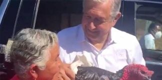 Angélica Lara of Santa Ana presents the president with a turkey